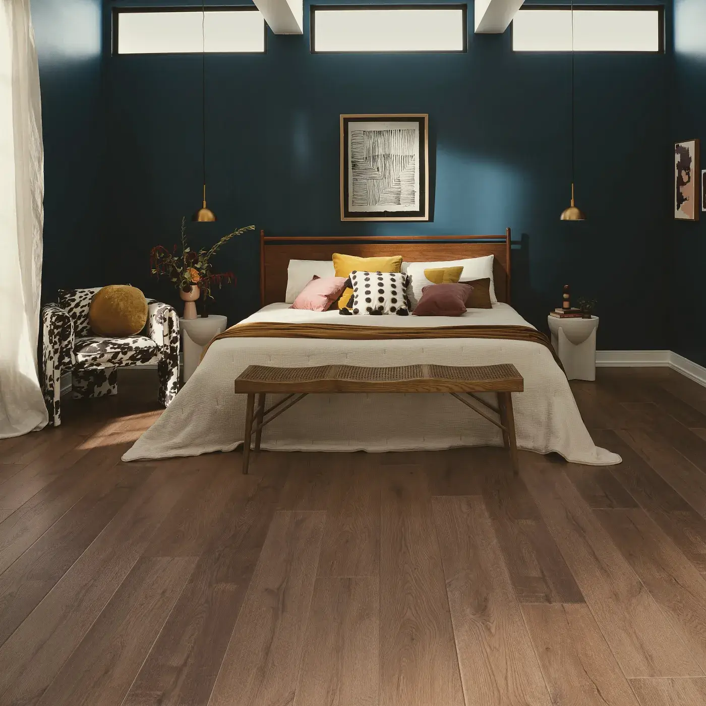 Bedroom with dark blue walls and luxury vinyl flooring