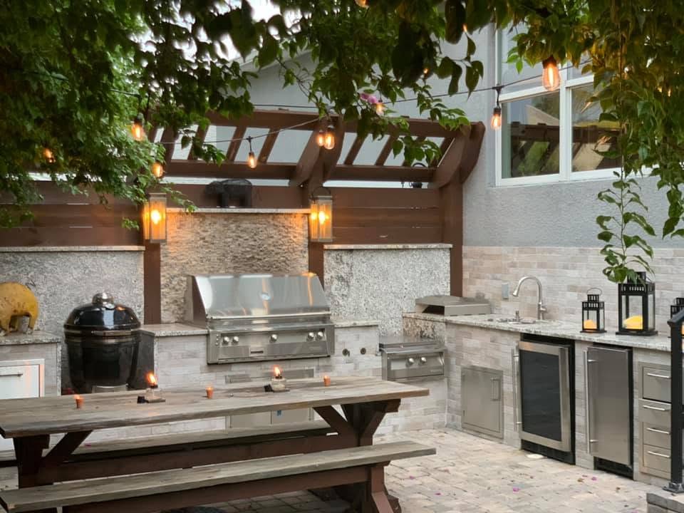 Outdoor patio area with built-in kitchen